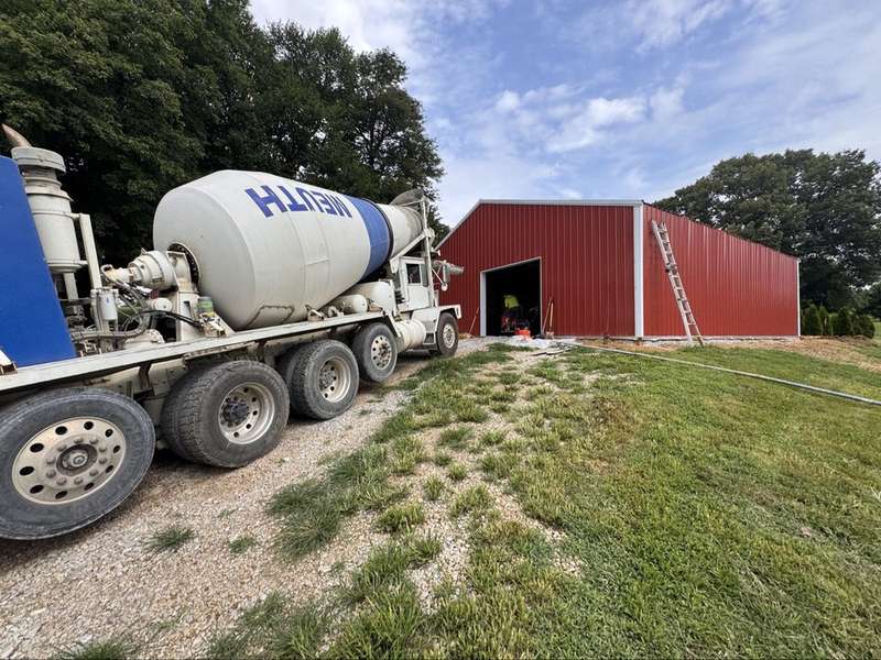 Concrete mixer truck delivering to a job site