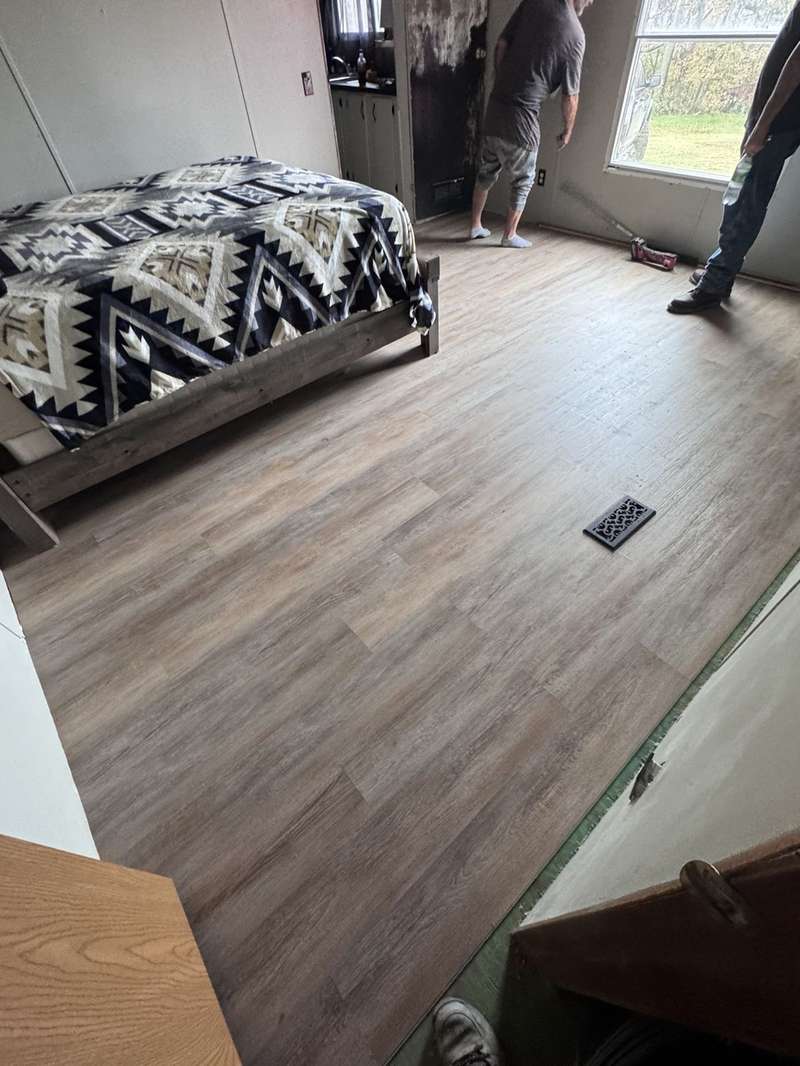 Finished vinyl plank bedroom floor