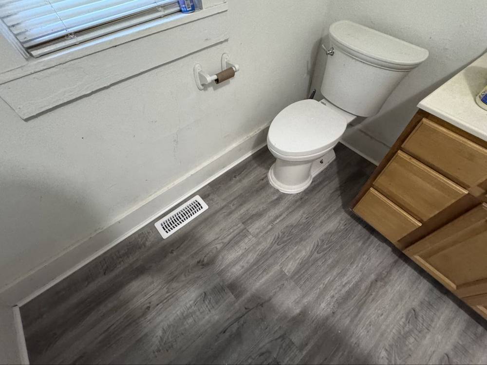 Finished bathroom with new toilet installed