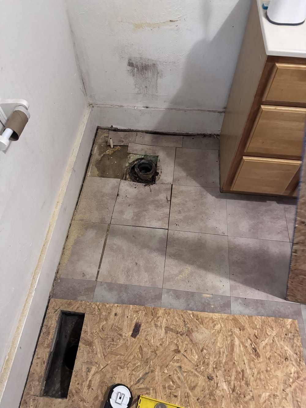 Old bathroom floor torn out for replacement