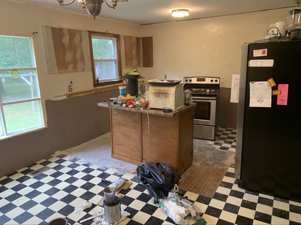 Kitchen remodel with island in place during demo