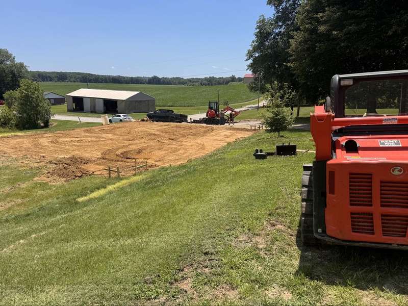 Graded building pad with equipment on site