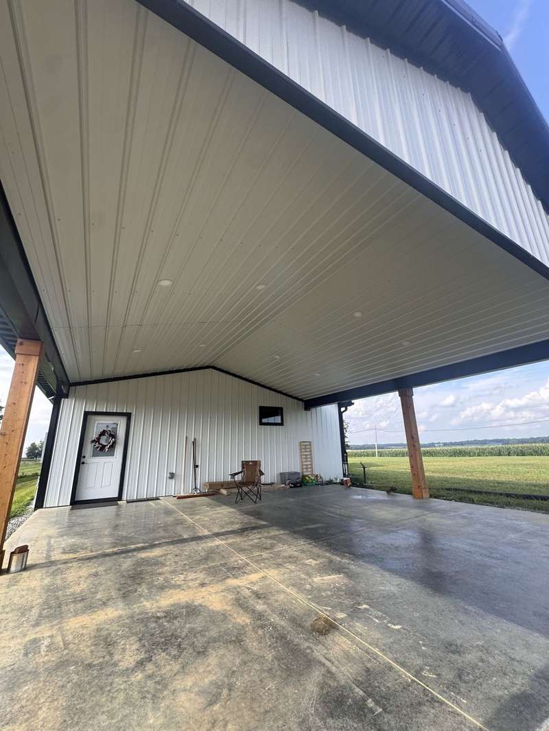 Finished pole barn porch with concrete patio