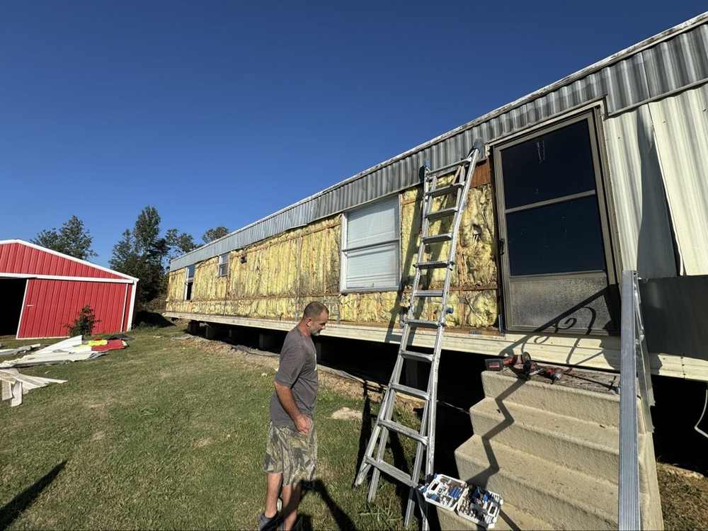 Home stripped down to studs and insulation for new siding