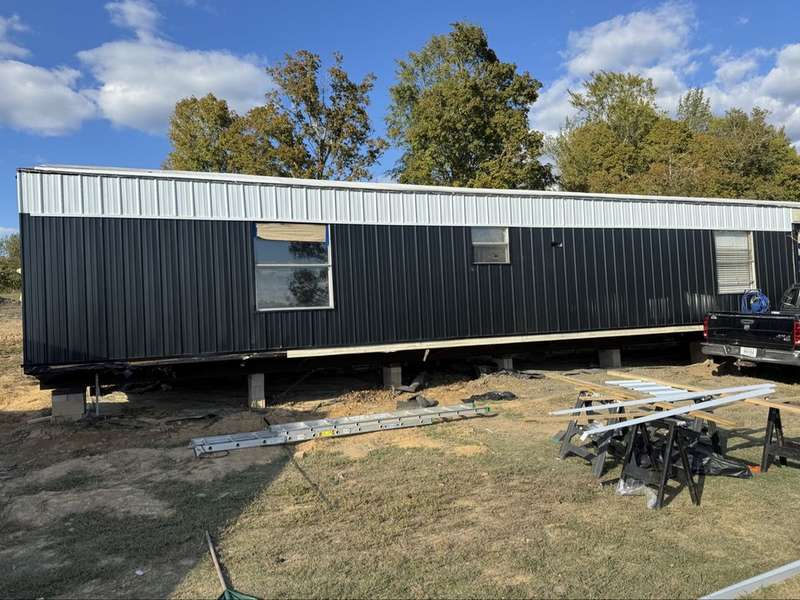 New black and white metal siding taking shape