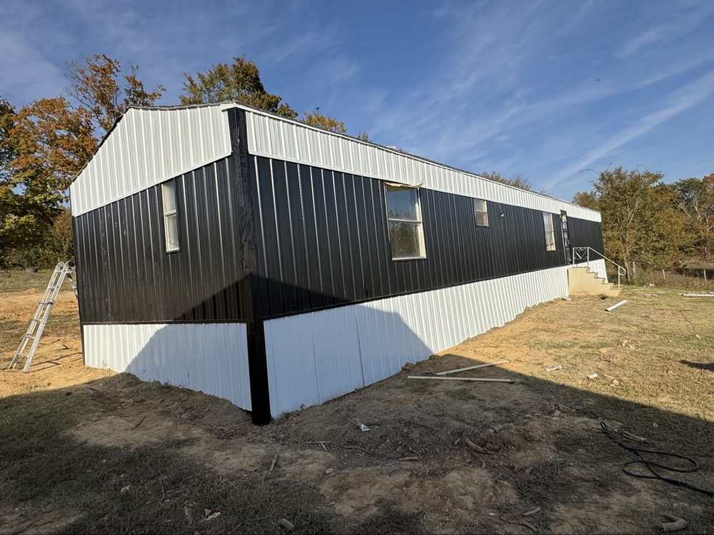 Finished black and white siding, full side view